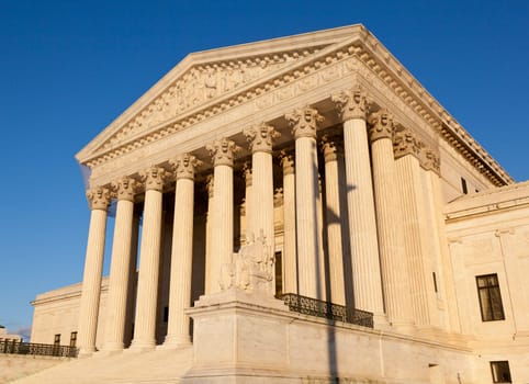 Late afternoon winter sun illuminates front of supreme court in Washington in winter