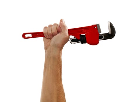 Senior male holding a large red wrench isolated against white