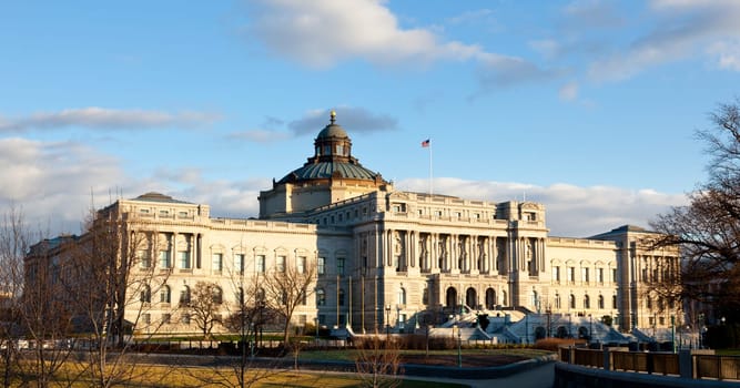 The setting sun lights up the US Library of Congress with warm light in late afternoon