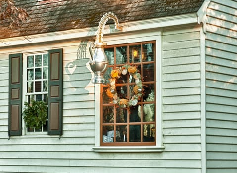 WILLIAMSBURG, VIRGINIA - DECEMBER 30: Sun rises on old shop on December 30, 2011. Colonial Williamsburg&#039 s 301 acres includes many restored buildings and houses
