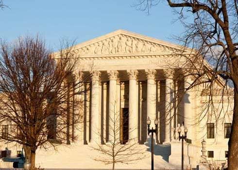 Late afternoon winter sun illuminates front of supreme court in Washington in winter