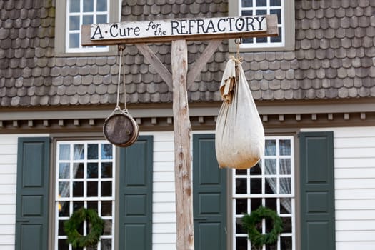 WILLIAMSBURG, VIRGINIA - DECEMBER 29: Antique sign outside tavern on December 29, 2011. Colonial Williamsburg&#039 s 301 acres includes many restored buildings and houses