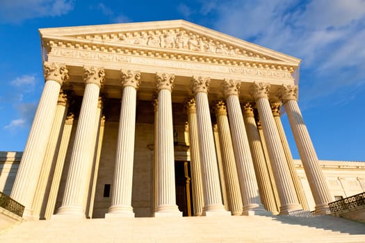 Late afternoon winter sun illuminates front of supreme court in Washington in winter