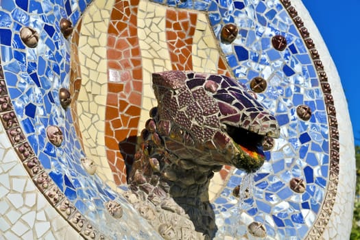 Mosaic Dragon made of broken ceramic tiles in Park Guell designed by Antoni Gaudi , Barcelona, Spain