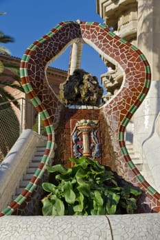 Ceramic dragon fountain at Parc Guell designed by Antoni Gaudi, Barcelona, Spain.