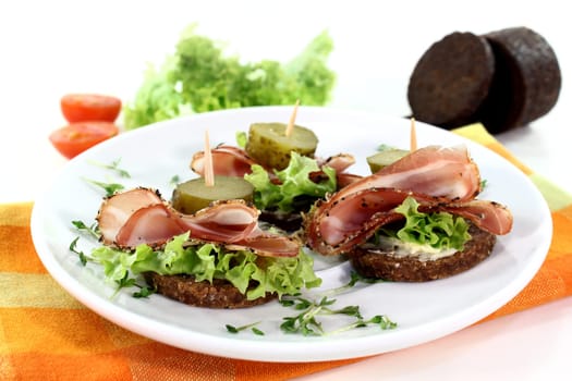 Canapes with smoked bacon and pickle