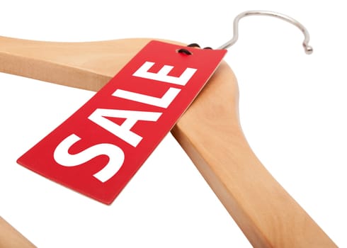 Red Tag With Sale Sign Hanging on Wooden Hanger
