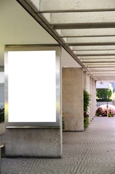 Blank billboard in a shopping mall passage - clipping path included