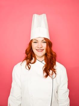 Female Chef on pink background