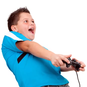 Teen boy having fun  playing with video console. Isolated on white.