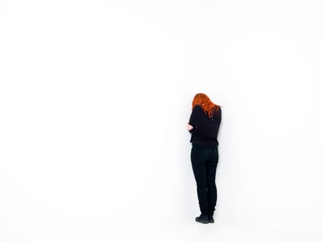 Sad woman in a white room