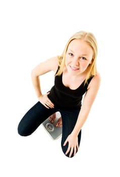 Young Girl on weight scale isolated on white background