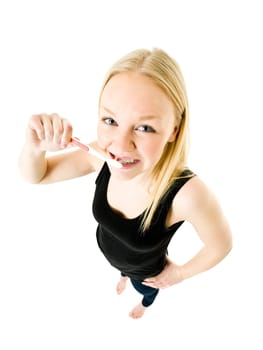 Young woman brushing teeths isolated on white background