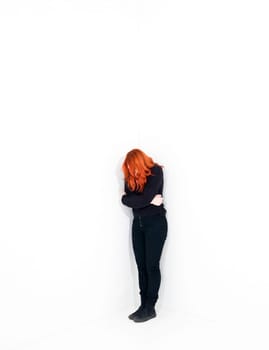 Sad woman in a white room