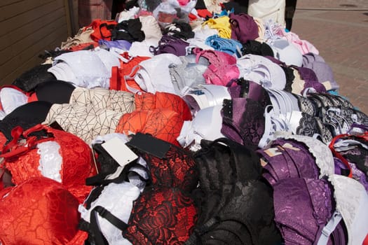 colorful bras for sale in outdoor flea market