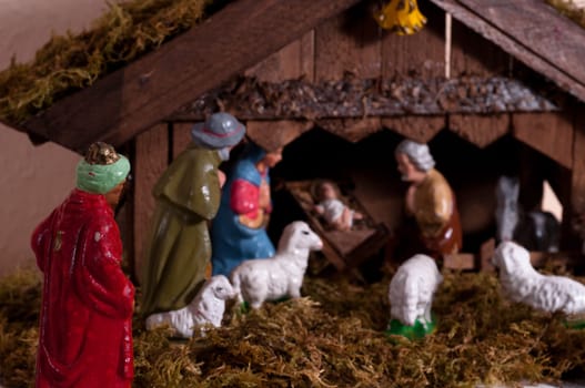 Nativity scene with a king,sheep and the Christ child