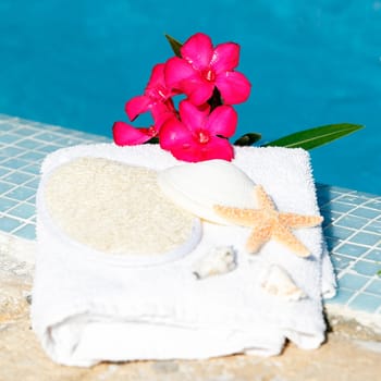 Spa setting with flower and white towel