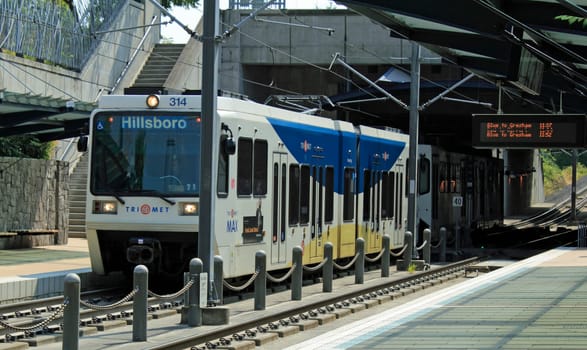 BEAVERTON, OREGON - AUGUST 5: Light rail train arriving at the Beaverton Sunset Transit Center station on August 5, 2010 in Beaverton, Oregon. A central hub for trains and buses since 1998.