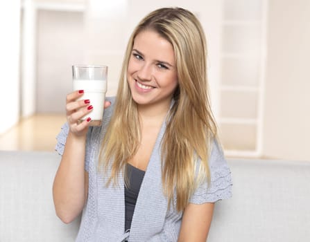 Young woman with glass of milk