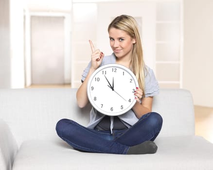 Young woman with big clock