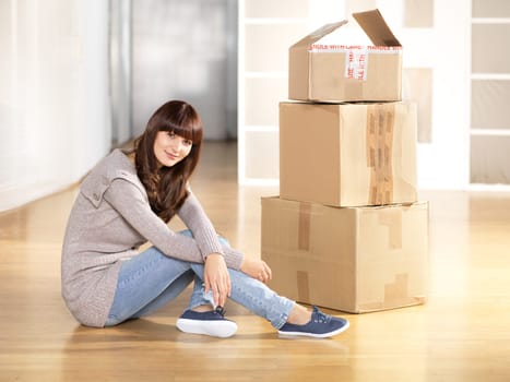 Young woman with moving boxes
