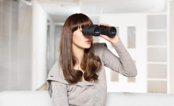 Young woman with binoculars
