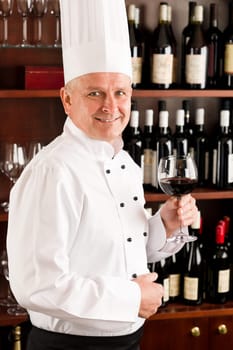 Chef cook wine bar professional standing confident in restaurant