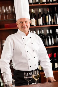 Chef cook wine bar professional standing confident in restaurant
