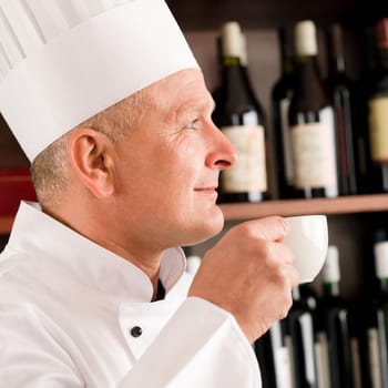 Chef cook relax break enjoy cup of coffee in restaurant