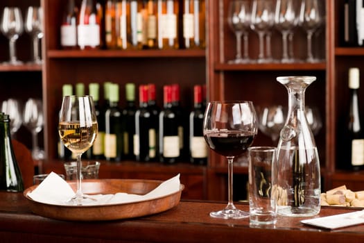 Wine bar tasting set up tray decoration bottles in restaurant