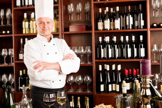 Chef cook confident professional posing in restaurant cross arms