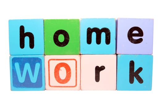 toy letters that spell homework against a white background with clipping path