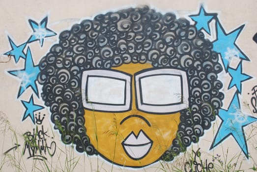 photo of a graffiti on a abandoned city wall