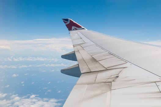 ST JOHNS, ANTIGUA - AUGUST 17: view of Boeing 747 wing of Virgin Atlantic Airways with blue sky clouds close to V. C. Bird International Airport in Antigua on August 17, 2011 in St. John&#039 s, Antigua