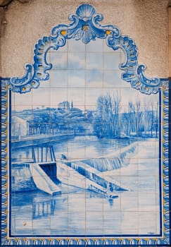 TOMAR, PORTUGAL - DECEMBER 15: beautiful painted ceramic tilework of Nabão river and Frades weir in Tomar downtown, Portugal on December 15, 2011 in Tomar, Portugal