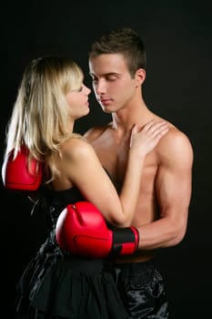 Young beautiful couple of blond girl and handsome boxer man