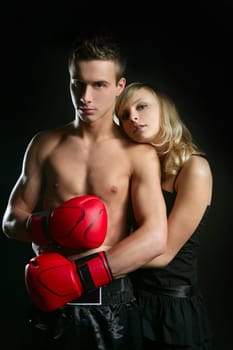 Young beautiful couple of blond girl and handsome boxer man
