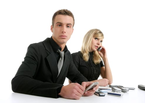Business couple with many mobile telephones, isolated over white
