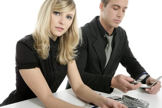 Helpdesk metaphor with many telephones. young business couple