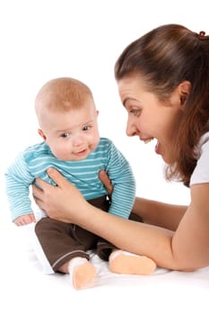 Happy mum plays with the small child a white background.