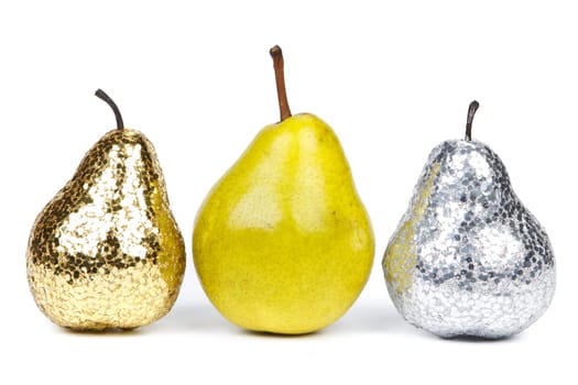 Golden, silver and natural pears on a white background. Concept for success.