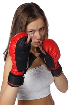 Sporty girl in red fighting gloves on a white background.