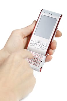 Modern mobile phone in a woman&#039 s hand on a white background.