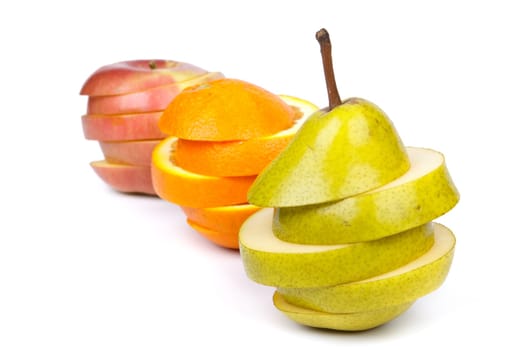 Fresh sliced fruits on a white background. Close up.