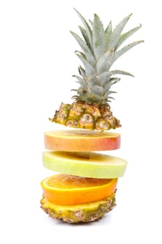 Mixed sliced fruit on a white background. Close up.