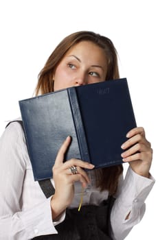 The beautiful young girl with a diary on a white background.