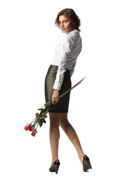 The beautiful girl with a bouquet of roses on a white background.
