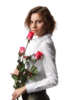 The beautiful girl with a bouquet of roses on a white background.