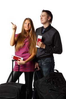 Happy young family with suitcases and tickets on a white background. Vacation.
