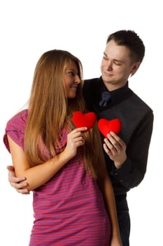 Young enamoured couple with a heart on a white background.
